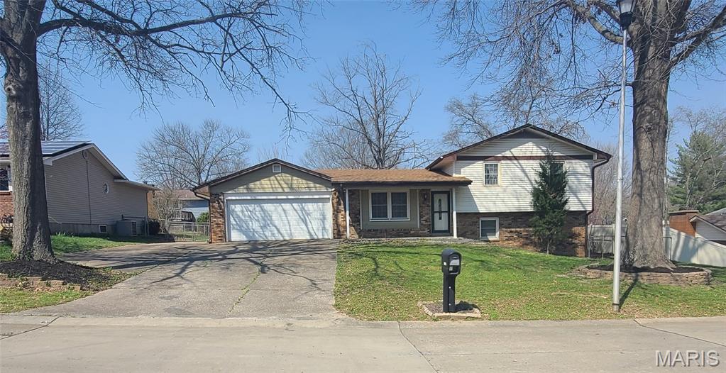Setup a viewing and this house will make you feel you're at home!! This is a beautiful cozy home within a reasonable budget sitting in a desirable neighborhood. Check all the boxes!! Within a reasonable budget Great Neighborhood New roof December 2025 2 car garage Over 2 bedroom At least 2 full baths Has Basement Custom designed kitchen 2 Dishwashers Plenty of parking Can drive a truck around both sides of house Fenced back yard Deck Step in and the lady will immediately adore this kitchen that is beautiful and functional featuring quartz countertops, 2 dishwashers, air fry stove, undercabinet/stained glass/wine bottle lighting. Entertainment capabilities are epic with prewiring for surround sound in the living room and family room with projector wiring also in the family room. Any man should be pleased with separate breaker box in the large 2 car garage with a large lighted workbench, multiple 220V outlets inside and out of the garage capable of fast charging electric vehicles, welding and generator hookup. Plenty of concrete around the house to store a trailer, mower and any outside entertainment necessities for the multilayered deck and large outside firepit. There is a bonus room in basement and a utility room in basement. There is also a large attic storage with access from the garage. All utilities are electric with AC/Heat pump for efficient heating and cooling. Wifi thermostat, tank and tankless water heater, water softener. 1,566sqft above ground!!
