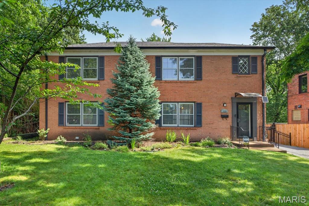 Experience sophisticated living in the heart of Clayton with this exceptional 2-bedroom, 2.5-bath luxury residence. Rich hardwood floors flow throughout the main living areas, creating a warm and inviting atmosphere. The spacious kitchen offers abundant cabinetry, stainless steel appliances, and generous workspace, seamlessly connecting to the living and dining areas for effortless entertaining. The finished lower level is a standout feature, showcasing an impressive wall of custom built-in cabinetry and shelving—perfect for a private library, executive office, media room, or flexible living space. Thoughtfully designed with abundant storage and upscale finishes, this level adds exceptional versatility to the home. Retreat to two generously sized bedroom suites, each offering comfort and privacy, while the additional half bath provides convenience for guests. Ideally located in one of Clayton's most sought-after neighborhoods, this residence combines luxury, functionality, and low-maintenance living just moments from premier dining, shopping, and business districts. A rare opportunity to enjoy refined living in one of St. Louis' most prestigious communities with AAA Clayton Schools.