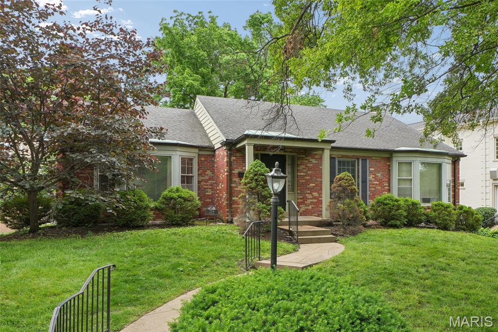 Rare Opportunity in the Heart of Clayton Gardens!  Unlock the potential of this solid 4-sided brick ranch, perfectly situated in one of Clayton’s most coveted neighborhoods and streets. Whether you choose to renovate this 3-bedroom, 2.5-bath gem or build your dream home, the possibilities are endless. Charming exterior details include a covered front porch with copper roofing, gutters, and classic bay windows. Inside, you'll find spacious rooms, french doors, 6 panel solid wood doors, double pane windows, hardwood floors (under carpeted rooms too!), 10X6 entry room, crown molding, and a cozy gas log fireplace with ornate mantle. Features a primary suite with a bay window, huge separate dining room, family room/office addition with recessed lighting. It has a high-efficiency Lennox furnace and A/C, and a massive walk-out basement with full sized above grade window, and recently finished 12X10 cedar closet/room, leading to a rear-entry tuckunder garage with updated door and opener. Live in the award-winning Clayton School District, just steps from fine dining, shopping, and parks.