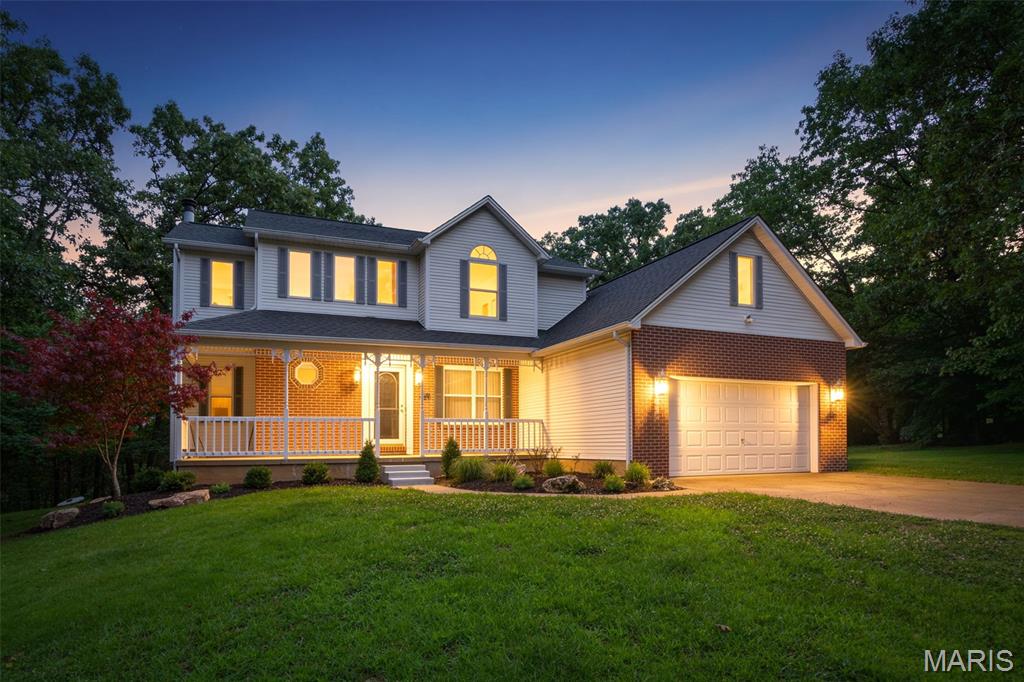 Welcome to 3401 Wiltshire Lane in Festus, Missouri, where the peace and privacy of country living meet the convenience of being just minutes from town. Situated on 3 picturesque acres in a private community of only 12 homes, this spacious 4-bedroom, 3-bath, two-story residence offers more than 2,500 square feet of living space surrounded by mature trees and natural beauty.

From the moment you arrive, the inviting covered front porch creates a warm first impression. Detailed trim work, classic brick accents, and thoughtfully maintained landscaping complement the home's timeless design. Whether enjoying a quiet morning with coffee or unwinding in the evening, the front porch offers a welcoming place to take in the peaceful surroundings.

Inside, the home's spacious layout provides room to gather, entertain, and relax. Large windows invite natural light throughout the day while offering views of the surrounding acreage and wooded landscape. The floor plan balances open living spaces with private areas, creating flexibility for everyday living and special occasions alike.

One of the property's standout features is the massive deck located just off the breakfast room. Elevated above the backyard and surrounded by mature trees, this outdoor living space becomes a natural extension of the home. Imagine weekend barbecues, outdoor dining, family gatherings, or simply enjoying the changing seasons from your own private retreat.

The acreage itself creates a setting that is increasingly difficult to find. With mature hardwoods, open spaces, and room to roam, the property offers the feeling of a countryside escape while remaining close to everything you need. Wildlife sightings, peaceful evenings, and a sense of privacy become part of daily life.

Property Highlights
4 Bedrooms
3 Bathrooms
Over 2,500 Square Feet
Approximately 3 Park-Like Acres
Two-Story Design
Large Covered Front Porch
Massive Deck Off Breakfast Room
Mature Trees Throughout Property
Private Street Community with Only 12 Homes
Award-Winning Festus R-VI School District
Easy Access to Highway 67
Convenient Commute to St. Louis
Lifestyle Benefits

What makes 3401 Wiltshire Lane truly special is the lifestyle it provides. Here, you can enjoy the tranquility of country living without sacrificing convenience. Shopping, dining, healthcare services, entertainment, and everyday necessities are only minutes away in Festus and surrounding communities. For commuters, Highway 67 offers quick access north toward St. Louis, making work, sporting events, concerts, and city attractions easily accessible.

This property offers the best of both worlds: space to spread out and enjoy nature, combined with the convenience of modern amenities nearby. Whether you're hosting friends on the expansive deck, exploring your own acreage, or simply appreciating the quiet setting after a busy day, this home delivers a lifestyle centered around comfort, privacy, and connection to the outdoors.

Properties that combine acreage, privacy, a small community setting, award-winning schools, and convenient access to St. Louis are increasingly rare. 3401 Wiltshire Lane presents an opportunity to enjoy all of those advantages in one exceptional location.