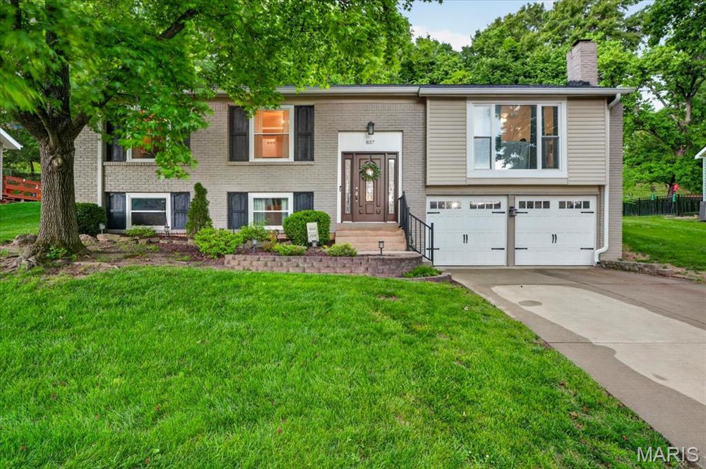 Professional photos will be uploaded Tuesday, May 19. Private showings begin Thursday, May 21. Open House Sunday May 24th 1pm-3pm.

Welcome to 837 Pontoison Drive, a beautifully cared-for home tucked away on a quiet, tree-lined street with a peaceful backdrop of mature trees. From the landscaping to the stonework to the inviting backyard spaces, it is clear this home has been thoughtfully maintained and improved over time.

Inside, the home has a warm, polished feel with custom touches throughout. The owners have added custom stairs and handrails, board and batten accents, wood-trimmed walls, custom corbels, a custom wood beam, and built-in cabinetry, creating a sense of character that feels both elevated and comfortable. The vaulted great room features hardwood flooring, a gas fireplace with a floor-to-ceiling brick surround, and large windows that bring in beautiful natural light.

The kitchen offers granite countertops, stainless steel appliances, timeless wood-toned cabinetry, tile flooring, center island seating, pantry storage, and stylish lighting. The main level offers a smart circular flow, with living, dining, and kitchen spaces that connect naturally for everyday living and entertaining.

The bedrooms are comfortable and functional, with custom closet systems in three of the four bedrooms. One bedroom has been transformed into an impressive home office with custom built-in cabinetry and workspace, offering a great setup for working from home, studying, or staying organized.

All carpet throughout the home is brand new, including the bedrooms and lower level. The finished lower level adds valuable living space with flexibility for a recreation area, workout space, media room, playroom, or whatever best fits your needs. The garage and workshop area provide excellent storage and functionality for tools, hobbies, projects, and everyday organization.

The backyard is one of the home’s true highlights. Enjoy a large stamped concrete patio, pergola-covered lounge area, custom fire pit space, extensive stonework, mature landscaping, and peaceful wooded views. It is a space that feels private, inviting, and ready for relaxing or entertaining.

Additional updates include a newer roof, an updated and insulated garage door, and a new HVAC system being installed prior to closing. Conveniently located near Big Bend, Manchester, Highway 141, and I-270, this home offers a rare blend of character, comfort, updates, and outdoor living.