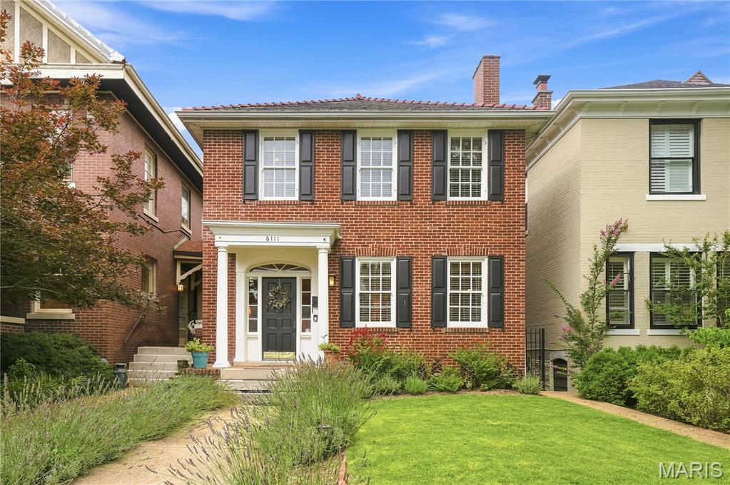 Classic Georgian Colonial Revival featuring timeless brick architecture and elegant curb appeal in a sought after block of the Skinker DeBaliviere neighborhood. The home has been lovingly cared for and updated over the past 25 years preserving the historic integrity while modernizing for today's lifestyle. The spacious living room (currently set as a dining room) has original stained glass windows, dark wood floors and built-ins flanking the fireplace. Warm and inviting dining room (currently used a family room) ties all the spaces together. The kitchen has been opened up and features full length mission-style wood cabinetry and upscale appliances including a Fisher & Paykel double dishwasher, Decor wall over and microwave, and gas cooktop. Main floor laundry too!

The real show-stopper here is the spectacular all glass conservatory room with AC and heat ('23), slate and onyx flooring that overlooks the incredible professionally designed low-maintenance yard. All seasons will be enjoyed and relished in this one-of-a-kind space. Step out onto the composite deck and into the outdoor living area including a paver patio, hard-piped firepit with seating all around and stunning garden spaces. There is a 2 car parking slab that's primed and ready for a garage, or keep it open for additional outdoor entertaining areas. Upstairs are 3 bedrooms including the large primary with room to grow in for flexible arrangement. Full bath has been updated with period appropriate tilework. There are gorgeous wood doors with crystal knobs throughout. Clean and dry basement has a half bath.

All wiring and plumbing has been updated including the water line coming in. AC and heat pump '22, hot water boiler and radiators are also functional if someone prefers radiant heat. Roof was replaced in 2008 with 50 year shingles. A one year Assurant Home Warranty is included for peace of mind. On top of it all is this fabulous location, a tight-knit walkable community with the annual porch concert festival and so close to Wash U, Forest Park, The Pageant and all the restaurants along Delmar. This is a must see home ready for its next chapter.
