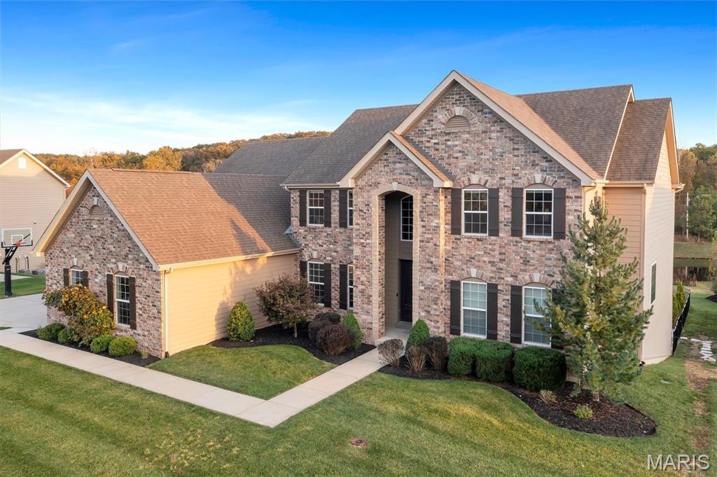 This luxurious in-ground pool with hot-tub, swim-up bar, outdoor kitchen, and a sun-soaked lounge could be yours for the summer ahead! This incredible outdoor living space is created for privacy, pure relaxation and effortless entertaining.

This is your chance to own a resort-style experience with this 5-bed, 4.5-bath retreat blending classic charm with modern sophistication!

Inside you'll find a main floor designed for comfort and every day life. The primary suite offers true sanctuary living, complete with a walk-in closet and en suite bathroom. While the office/study provides the perfect at home work space close to all the happenings of the home. 

At the heart of the home is the chef’s kitchen—sleek white cabinetry, tiled backsplash, premium stainless steel appliances, and an expansive island built for cooking, gathering, and everyday life. The adjacent great room is breathtaking, framed by a dramatic wall of two-story windows that flood the space with natural light and overlook the show-stopping backyard and beautiful naturescape of the neighborhood pond.

Upstairs, you’ll find three generous bedrooms with abundant closet space, two full bathrooms (one jack-and-jill style), and a versatile common area—perfect for a playroom or hangout zone.

The finished basement elevates entertaining even further with a stylized wet bar decked out in black cabinetry and slate-and-gold backsplash, plus plenty of room for games, seating, and hosting. An additional bedroom and full bath make it ideal for guests. The star of the lower level: a fully outfitted media room ready for movie nights and memories.

This is a home that must be experienced in person to appreciate its luxury, scale, and lifestyle. Schedule your showing to see it in person TODAY!