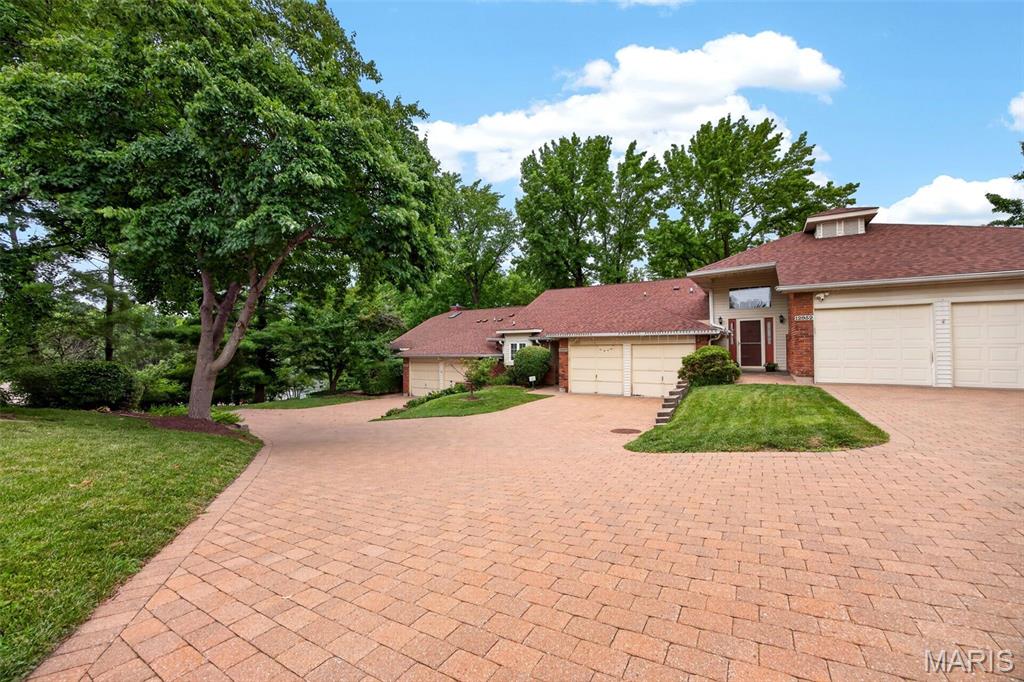 No Showing to Open House on Sunday 1-3pm on 7-12-2026. Welcome to this luxury villa/Split level town home. 2 sty vaulted ceiling . updated 2 bedroom and 2 full bathrooms, updated Kitchen with luxury custom designed cabinets and lighting. Electric cook top.  New laminate floor . Quartz counter top. New concrete  patio . attached 2 car garage w/remote control. 5 year roof and 6 years HVAC. Great location, easy  to access to Hwy 270/364 , close to shopping center and restaurant , Hospital and Parkway high school.…. a must see