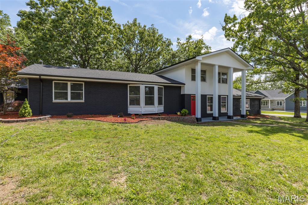 Welcome to your dream home in Terre Du Lac! This beautifully remodeled 4-bedroom, 3.5-bath multi-level home sits on a rare double corner lot totaling approximately 0.78 acres, offering privacy, space, and modern updates throughout. Step inside to discover new flooring, windows, doors, and tastefully updated bathrooms. The stunning kitchen features granite countertops, a center island, stainless steel appliances, and a spacious walk-in pantry, flowing seamlessly into the formal dining room and inviting living spaces.  The expansive primary suite is a true retreat, complete with a huge walk-in closet and luxurious oversized bath. A second master suite on the upper level provides flexibility for guests or multi-generational living. Enjoy cozy evenings in the family room with a fireplace, or relax outdoors on the covered front porch, covered patio, or deck overlooking the fenced backyard.  Additional features include a 2-car detached garage with workshop area, unfinished partial basement for storage or future expansion, and plenty of room to enjoy both indoors and out. All of this is located within the sought-after Terre Du Lac community, where residents enjoy boating, fishing, swimming, golf, and a variety of recreational amenities. This move-in-ready property offers the perfect blend of comfort, style, and lifestyle!