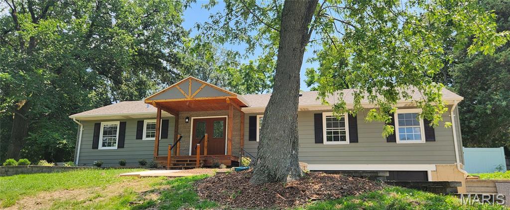 This beautiful 4 bed 3.5 bath renovation is in a fabulous location in a transitioning neighborhood where home values can exceed 700k! Situated in Rockwood schools on an over 1/2 acre lot that has a 6 foot privacy fence in the back yard. Custom tile work abounds in all bathrooms, new flooring, lighting and gorgeous white shaker cabinets with custom backsplash in the kitchen. New appliances including a beverage cooler and a newer refridgerator that was existing. Two bedroom area with its own entrance plus spacious bathroom and double sinks. Huge Primary bedroom with ensuite bath, walk in closet that has a stackable laundry option plus a laundry closet in the basement. Cozy family room with a wood burning fireplace and sliding door to the backyard patio. Additional bedroom in the basement with large double sink bathroom and a finished recreation area. This home won't be available for long and you get alot of bang for your buck! Get into this neighborhood while you can at this price!!