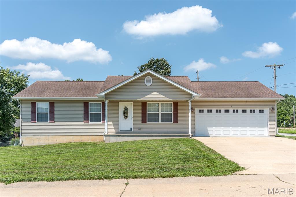Schedule your appointment to see this 3 bedroom, 2 bath home on a corner lot and convenient location. Large living room with vaulted ceilings with open plan to the dining area.  Kitchen has custom cabinetry -- the range, dishwasher, & refrigerator stay.  Main floor laundry is off the dining room with an exterior door leading to the covered back porch for easy grilling or relaxing.  The primary bedroom is generously sized and the adjoining bath has been renovated to include a walk-in shower.  Two more bedrooms and hall bath on the main level.  The basement is ready for you to decide how to use as additional living space or use for storage.  There are 2 large egress windows and also a rough-in for third bathroom.  Two car garage and easy access to I44 for commuters.  Showings begin Friday, July 17!  Don't miss the opportunity to call this one home!