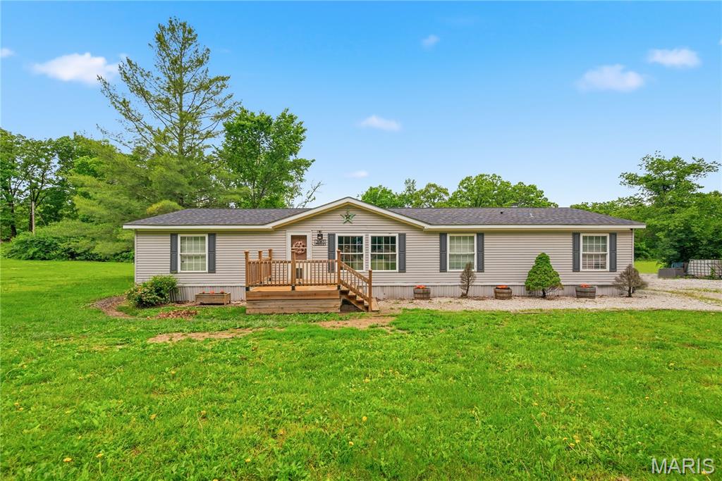 Opportunity to own over 1 acre tree-lined lot in the highly sought-after Wentzville School District! This property offers the perfect blend of space, privacy, and convenience while still being just minutes from shopping, restaurants, parks, and highway access. Inside, enjoy an open floor plan with spacious living and family room areas, a cozy fireplace, walk-in closets, and a private primary suite with separate tub and shower. Relax outdoors on the deck or front porch and enjoy the privacy and comfort of  mature trees and fire pit area. Rare opportunity to own a private retreat in a growing Wentzville location.