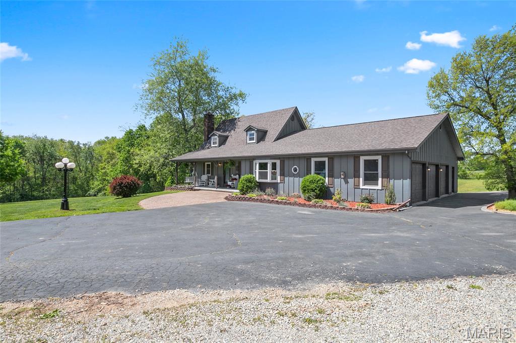 Pristine ranch estate on 10 acres of beautifully cleared land! 

This exceptional property is perfect for animal pasturage or simply enjoying the peaceful, pastoral setting. The large attached garage provides convenient access to the main-level laundry room for everyday ease.

Inside, you’ll find an open great room featuring vaulted ceilings with exposed beams, creating a warm and inviting atmosphere. The dining area is highlighted by a charming bay window, and stunning wood floors run throughout the main level. A striking stone fireplace with a gas insert serves as the centerpiece of the living space.

The kitchen is well-equipped with two ranges, making it ideal for cooking, entertaining, or large gatherings.

The spacious primary suite offers a private retreat with a sitting area, built-in shelving, a large walk-in closet, and a luxurious en-suite bath featuring an oversized jacuzzi tub, separate shower, and dual vanity.

The walkout basement opens to an expansive deck with an above-ground pool seamlessly integrated into the design — perfect for relaxing or entertaining.

In addition, the detached garage is a standout feature, complete with a separate industrial kitchen and its own HVAC system, half bathroom, offering incredible flexibility for hobbies, business use, or entertaining.