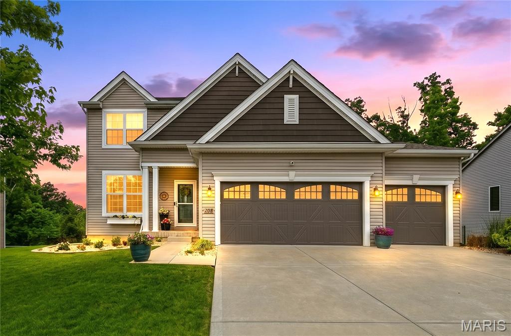 Welcome home to over 3,200 SQFT of beautifully finished living space designed for both everyday comfort and effortless entertaining. From the moment you step inside, you’ll love the bright, open floor plan featuring 9’ ceilings, abundant natural light throughout, a versatile flex room/home office, cozy gas fireplace, laminate flooring and updated light fixtures. 
The heart of the home is the inviting kitchen showcasing 42” cabinetry, granite countertops, classic white subway tile backsplash, stainless steel appliances, a large pantry, plus the sweetest custom “puppy pantry” a tucked-away feeding station complete with storage for food, leashes and adorable wallpaper details.
Upstairs, retreat to the spacious primary suite featuring a coffered ceiling and spa-inspired bath with double vanities, soaking tub, separate shower and oversized walk-in closet. Three additional bedrooms, a full hall bath and convenient second-floor laundry complete the upper level.
The finished walkout lower level offers the perfect extension of living space with a large family/recreation area, kitchenette, full bath and ample storage.
Step outside and unwind in your own private backyard oasis surrounded by mature trees. Featuring a maintenance-free composite deck, expansive stamped concrete patio with fire pit for those upcoming summer nights, irrigation system and fully fenced yard backing to trees. Whether entertaining guests or enjoying a quiet evening at home, this is the ONE!  Book your showing today! THIS ONE WONT LAST LONG!