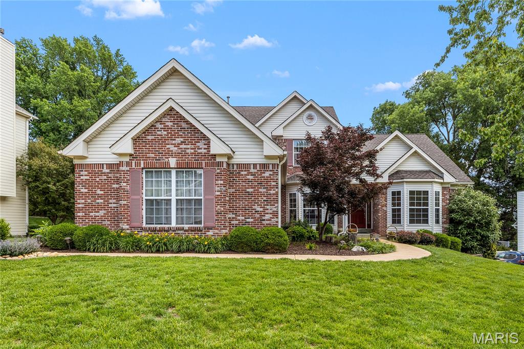 Don't miss the chance to own this exceptional 1.5 story 5 bedroom, 4.5 bath home in the desirable Oak Creek Meadow subdivision and sought after Parkway Central School District.  As you enter the sunlit foyer you will be greeted by an open floor plan with gleaming hardwood floors throughout the main level which includes a spacious dining room a large office, a great room with soaring ceilings and a window wall, a main level laundry with a sink and plenty of storage, a beautiful primary master suite and a gourmet kitchen that opens into the family room. The stunning kitchen is a dramatic focal point complete with granite countertops, custom cabinetry and a walk-in pantry. The spacious and cozy family room is open to the kitchen and has a gas fireplace. The master bedroom suite presents tray ceilings, large walk-in closet with custom built-ins, and an opulent ensuite bath with a soaking tub, separate glass shower, and double sinks. On the second floor you will find three more spacious bedrooms, one with an ensuite bathroom and a hallway that opens to a magnificent view of the great room below.  The spacious walk out basement includes a large recreation area, kitchenette, an additional bedroom and full bath and plenty of extra storage space. The backyard features a maintenance free NEW composite deck, a sprinkler system, and a large beautifully landscaped level backyard. Upgrades include 8' doorways, 9' ceilings, an oversized 3 car garage, and much more! With restaurants, grocery stores, hospitals, shopping nearby, close proximity to major highways, and prime Chesterfield location, what's not to love. This is a  MUST see!