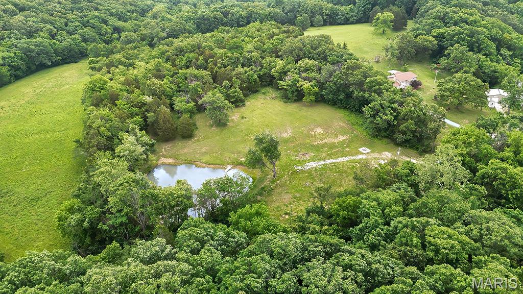 5.87 Acres – Ready for Your Dream Home!
Bring your vision to life on this beautiful 5.87-acre property, perfectly prepared for your future home set up cleared. Overlooking your own established one-acre pond, this land offers a peaceful and private setting surrounded by mature woods.
Utilities are already in place with well, septic, and electric available, making it easy to start building right away. Access is provided by private gate and fencing on a small gravel road, enhancing both privacy and seclusion.
Enjoy the best of both worlds—quiet country living just minutes from major Hwy 55 for convenient commuting. Whether you're looking to build your forever home, a weekend retreat, or invest in acreage, this property is ready to go.
Don’t miss this rare opportunity to own a  private tract with utilities  already in place!