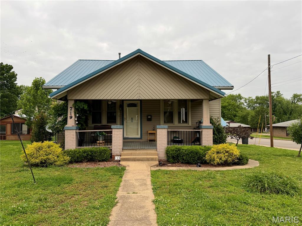 Great opportunity to make it your own! Corner lot, fenced yard, detached garage! A little tlc will go a long way in this charming craftsman style home.