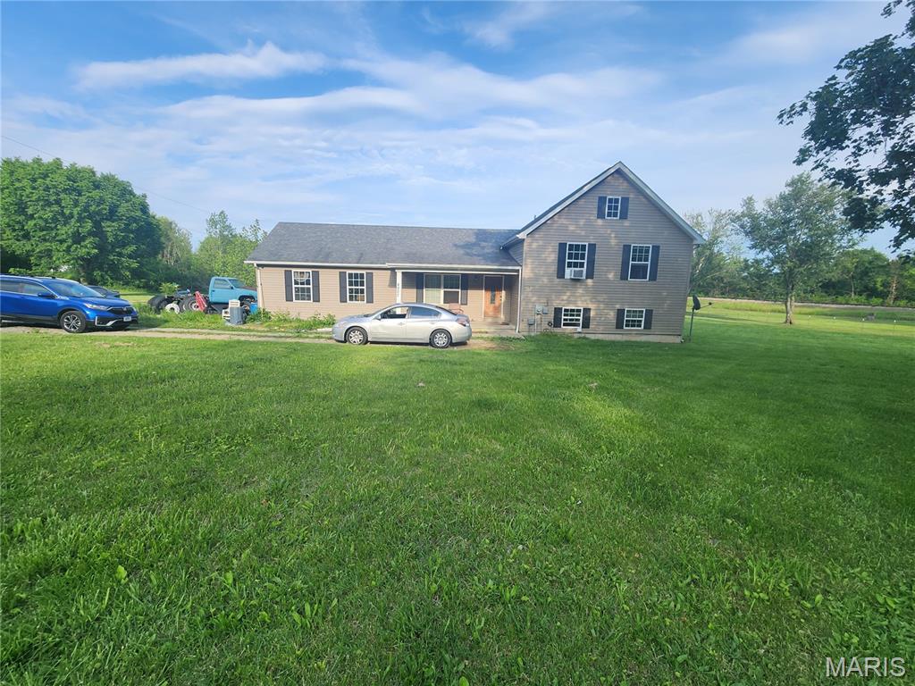 Located in Farmington, this 4-bed, 3-bath single-family home sits on a spacious 3-acre lot and offers a highly functional layout. Built in 2012, the property includes an attached garage and a peaceful country setting with plenty of room to grow. While the home is fully livable and functional, parts of the interior are a blank canvas awaiting your final aesthetic choices, making it perfect for buyers looking to build equity or personalize their space over time.