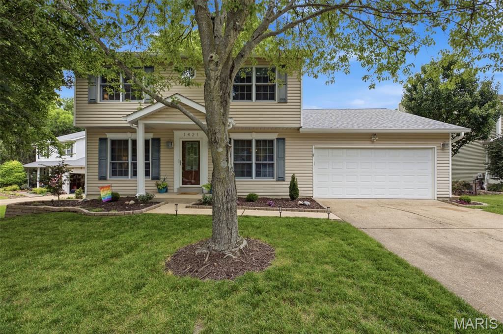 Welcome to this completely updated, move in ready classic 2 story home tucked away on a quiet cul-de-sac in desirable Kirkwood! Offering 5 bedrooms, 2 full baths, and 2 half baths, this beautifully maintained home blends timeless charm with modern updates and thoughtful design throughout. Step inside to find hardwood floors throughout much of the main level, elegant wainscoting, and beautiful architectural details that create a warm and inviting atmosphere. The spacious living room is the perfect gathering space, centered around a cozy woodburning fireplace and surrounded by large windows that fill the home with natural light. The office and living room both feature built-in bookshelves, adding character and functionality. The updated eat-in kitchen is designed for everyday living and entertaining, featuring sleek maple cabinetry, granite countertops, stainless steel appliances, a breakfast bar with seating for two, and a charming breakfast nook. A garden window above the sink provides the perfect spot for herbs and houseplants. The convenient laundry room is located just off the kitchen for added ease. Just off the living room, enjoy the large screened-in porch with a beadboard ceiling overlooking the gorgeous fenced backyard. The private outdoor space backs to woods and includes a corner patio that is ideal for fire pit evenings, outdoor dining, and relaxing with friends and family. Upstairs, the spacious primary suite offers a peaceful retreat with an updated en-suite bath featuring an elegant double vanity and tiled standing shower. Three additional bedrooms and another beautifully updated full bath complete the second floor. The finished walkout lower level provides even more living space with a large recreation room perfect for movie nights, game days, or entertaining, along with a 5th bedroom and half bath. Additional highlights include an attached 2 car garage and a peaceful, walkable neighborhood setting. Enjoy being just minutes from Kirkwood Park with its aquatic center, playgrounds, ice rink, tennis courts, theater, pavilions, and lake, plus the incredible shopping and dining options in downtown Kirkwood. Located in the highly sought-after Kirkwood School District, this home offers the perfect combination of updates, space, location, and lifestyle. Don’t miss this opportunity to make it yours!