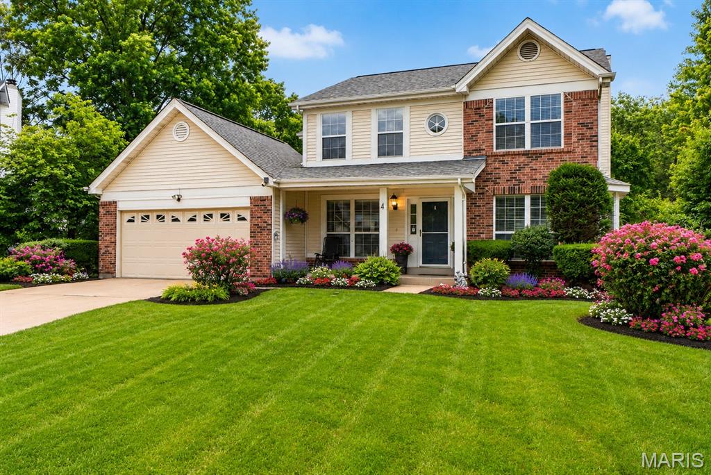 Welcome to this beautifully maintained two-story home nestled on a quiet cul-de-sac in the highly sought-after Twin Chimneys Village community! Enjoy an exceptional lifestyle just a short walk from the neighborhood pools, clubhouse, tennis courts, playgrounds, walking trails, and scenic lake. Relax on the inviting covered front porch or entertain family and friends on the oversized aggregate and patio overlooking the fenced backyard. This spacious home offers 4 bedrooms, 2.5 baths, a 2-car garage, and a finished lower level, providing plenty of room for everyday living and entertaining. The open floor plan features a formal living room and dining room, a welcoming family room with a raised-hearth brick fireplace, bay window, and abundant natural light, plus a beautifully updated kitchen showcasing granite countertops, stainless steel appliances, smooth-top range, corner sink, and ample cabinet space. The main floor also includes a convenient laundry room and an updated powder room with a furniture-style vanity. Upstairs, the vaulted primary suite offers a walk-in closet and private bath, while three additional bedrooms provide comfortable accommodations for family or guests. The finished lower level expands your living space with a large recreation room plus a versatile bonus room that can serve as a home office, media room, playroom, or possible sleeping area with walk-in closet. Additional features include a drywalled oversized garage with built-in storage cabinets, attic access ladder, ceiling fan, windows in the garage door; 6-panel doors, updated lighting and ceiling fans, recessed lighting, 200-amp electrical service, furnace and A/C approximately 8 years old, roof 6 years old, brand new carpet on the 2nd floor, and water heater approximately 10 years old. Don't miss this opportunity to own a spacious home in one of O'Fallon's most desirable communities, offering outstanding amenities, top-rated schools, and convenient access to shopping, dining, and major highways.
