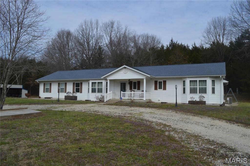 Have you been looking for that perfect home with 51 Acres of gorgeous land? Well wait no more because here it is. The property has 51.12 unrestricted acres of prime recreational and hunting ground featuring mature hardwoods, established ATV trails, a stocked pond, two year-round creeks, and abundant deer and turkey habitat. Tucked away in Montgomery County, this property includes a beautifully updated 2,549-square-foot ranch home and a 30x30 shop, making it the perfect full-time residence, hunting retreat, family compound, or weekend getaway. The home offers a newly added 28X22 Great Room to make relaxing with family and friends a vacation oasis every day. The large open Kitchen with custom wood cabinets that offer lots of storage space is a plus. The kitchen opens to the dining room and family room making for a great entertaining space for family and friends. Boasting 3 large bedrooms and 2 1/2 baths adds to the living enjoyment. The master bedroom has a Master Suite with with Full Bath and Laundry Room as well. A great view of the wandering wildlife can be enjoyed while relaxing in the 16X16 four season room. A beautiful gas fireplace accents the family room to make for the cozy chilly nights. The home has newly painted interior, new flooring throughout most of the home and all new lighting means all you have to do is relax. No work needed here. Plenty of storage in the large unfinished basement that includes a 1/2 bath, A quaint patio off the 4 seasons room is great to have your morning coffee or a evening meal. Another new addition is the large 30X30 3 door garage/Shop. The shop boasts 11 foot tall side walls and a 2 1/2 foot pitch, with oversize garage doors wide and tall. There are  many side by side / 4 wheeler trails cut in the property and lots of deer and turkey cutting through the property. With 51 acres and all the fabulous amenities this property offers you have to visit Montgomery City today and you will quickly fall in love realize this is the property you have been waiting for. With way more to talk about you have to visit this property to fully appreciate everything that is here and could soon become yours. Beautifully price at only $694,500 you must call today for your appointment.