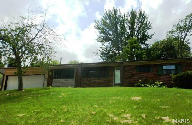 Don't miss this ranch style home with an attached two car garage and four bedrooms on the main floor! Special features include updates to the kitchen include quartz counter tops, brick and vinyl siding on the exterior, four bedrooms, two full baths, some updates to the bathroom, laminate flooring, partially finished basement, and much more!. Patio in the back of the house, partially fenced yard, vinyl siding and two car garage. Great opportunity to make your own. Set your appointment today!