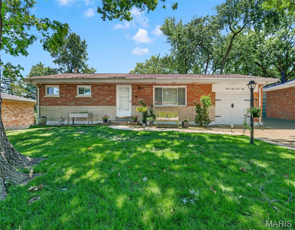 Welcome home to this charming 2-bedroom (3 if you include the downstairs sleeping room), 2-bath ranch in the heart of Affton, complete with an attached 1-car garage and a bright, open floor plan. Gorgeous hardwood floors welcome you into the spacious living room, which flows effortlessly into the dining area and beautifully updated kitchen. The dining room features built-in storage, a cozy window seat overlooking the backyard, and plenty of space for gatherings. The kitchen boasts custom cabinetry, a butler's pantry, and ample workspace for cooking and entertaining.

Down the hall, you'll find two comfortable bedrooms and a full hall bath. The primary bedroom offers two generous closets, while the second bedroom includes built-in shelving, drawers, and its own closet for added storage.

The attached garage provides convenient access to the finished walkout lower level, offering exceptional flexibility. Perfect for entertaining or multi-generational living, the basement features a spacious family room, kitchenette, full bathroom, laundry area, and a separate sleeping room that provides excellent space for guests, a home office, or hobby room.

Step outside to enjoy the patio and the fully fenced backyard with low-maintenance white vinyl fencing, creating a private space for relaxing or entertaining. With versatile living space, thoughtful updates, and a fantastic Affton location, this home is one you won't want to miss!