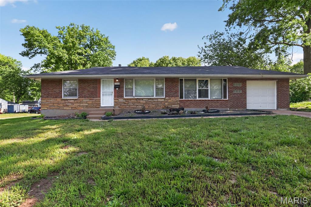 Welcome to this charming 3-bedroom, 1-bath ranch-style home nestled on a quiet residential street in North St. Louis County. Built in the early 1950s, this home offers classic appeal with a functional layout and great potential for personalization. The main level features a bright living area, a practical kitchen, and comfortable bedrooms with a mix of hardwood and carpet flooring. A full basement provides additional space for storage, laundry, or future finishing opportunities. Enjoy a spacious yard ideal for outdoor activities or entertaining. Conveniently located near major roadways, shopping, and local amenities, this property is perfect for homeowners or investors seeking value and opportunity. Don’t miss your chance to make this home your own!