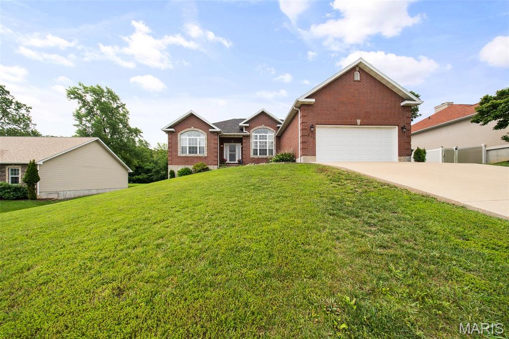 Welcome to this spacious 4-bedroom, 3-bath home nestled in one of Rolla's most desirable neighborhoods, complete with access to the clubhouse and community pool! Filled with natural light, this inviting home offers plenty of room to live, work, and entertain. The main level features real wood flooring, a bright breakfast area, and a well-appointed kitchen with solid surface countertops, pull-out cabinet racks, and included appliances—refrigerator, dishwasher, microwave, oven, and a brand new stove. The living room features a cozy fireplace. The main level also offers 3 bedrooms and 2 full bathrooms, including a comfortable primary suite with spa-like ensuite bathroom featuring a jetted tub and separate shower, and a generous walk-in closet.  Downstairs, the walk-out basement expands your living space with a recreation room, an additional bedroom with an electric fireplace for added comfort, a full bath, a dedicated movie room, and an unfinished basement room that provides excellent storage or future expansion potential. Additional highlights include all-electric utilities, a laundry room with a washer and dryer included, an attached garage, and a brand-new roof installed in 2025. Conveniently located in the heart of Rolla near shopping, dining, schools, and parks, this home offers the perfect combination of space, comfort, and neighborhood amenities.