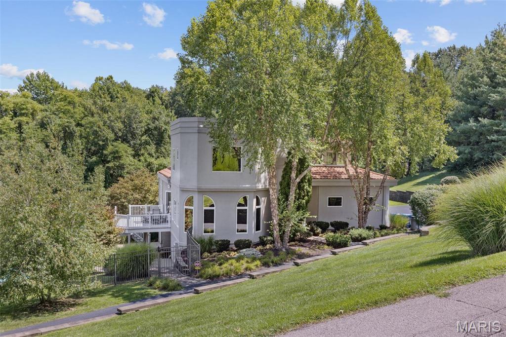 Welcome to your private sanctuary in the exclusive Riverscene Estates—where contemporary design meets serene living. This stunning custom home features 4 spacious bedrooms and 3.5 elegant bathrooms, thoughtfully laid out across a bright, open-concept floor plan. A striking wall of windows fills the home with natural light and frames picturesque views of the surrounding landscape. The heart of the home is a sleek, open kitchen designed for both style and function, complete with modern finishes and seamless flow into the main living and dining areas—perfect for entertaining. The oversized master suite is a true retreat, with additional bedrooms offering space and comfort for guests or family. The walkout lower level includes a private gym and additional living space. Enjoy total privacy on 3 acres with a resort-style pool, hot tub, and an oversized 3-car garage. A rare opportunity to own a modern masterpiece in one of the area's most coveted neighborhoods.