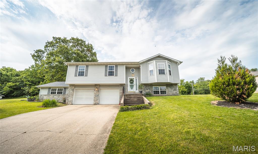 This beautifully updated 5-bedroom, 3-bath home in a desirable subdivision offers the perfect combination of space, comfort, and modern style. Featuring a functional split-level floorplan, this home was designed to give everyone room to spread out while still creating inviting spaces to gather and make memories. From the moment you walk inside, you’ll notice the warmth and durability of the luxury vinyl plank flooring that flows throughout the home, along with thoughtful updates that give the property a fresh, move-in-ready feel. The spacious main living areas are filled with natural light and provide a welcoming atmosphere perfect for both everyday living and entertaining guests. Downstairs, the lower-level family room creates the ultimate cozy retreat with a beautiful fireplace that makes the space ideal for movie nights, game days, or relaxing evenings at home. The updated bathrooms add a modern touch, while the generous bedroom layout provides flexibility for growing families, guests, or even a home office setup. Step outside to enjoy the fenced backyard, offering privacy and plenty of room for pets, play, or summer gatherings. The large shed provides excellent additional storage for tools, hobbies, or outdoor equipment. Conveniently located in a sought-after neighborhood, this home blends functionality, style, and comfort into one incredible package. Don’t miss your opportunity to make it yours—schedule your private showing today!