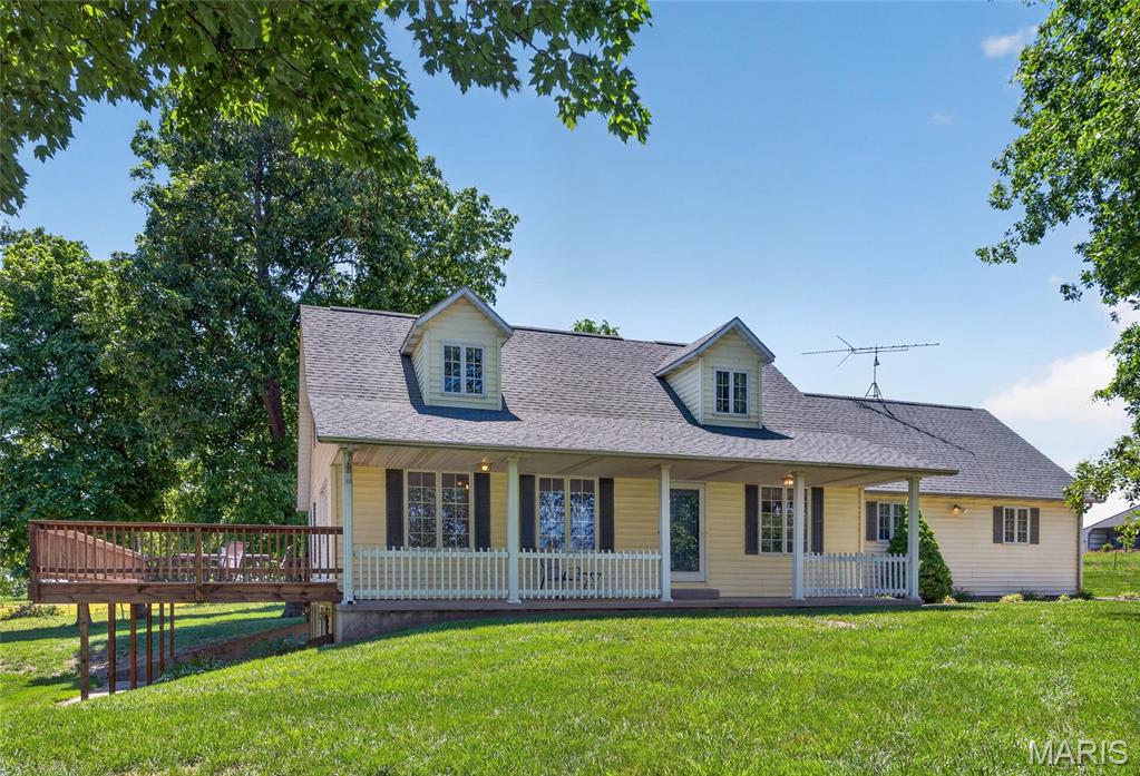 NOW PRICED WELL BELOW APPRAISAL!!   NEW FLOORING!!  WHOLE HOUSE GENERATOR!!  Experience refined country living in this stunning 4 bedroom, 3 bath home estate set on 6.23 acres of serene, picturesque land! Can negotiate up to 64 more additional acres, a lake and/or 60'x61' barn. This beautifully designed home offers a grand family room with a stunning floor to ceiling stone fireplace, vaulted ceiling, gorgeous views of the property, a bedroom used as a spacious office area, large kitchen with a new backsplash, gleaming hardwood floors, master bedroom on main level and much more! Step outside and unwind in the peaceful surroundings, perfect for evening relaxation or entertaining guests. The property also includes a large shop, ideal for storing your mower, tractor, tools, and outdoor equipment. Whether you're looking for a space to spread out or simply a quiet retreat, this home offers the best of country living with all the modern comforts! Make an appointment today to see this one-of-a-kind home! This stunning home, situated 6.23 acres, is also available for purchase with the home and 70 acres for $1.1 million.