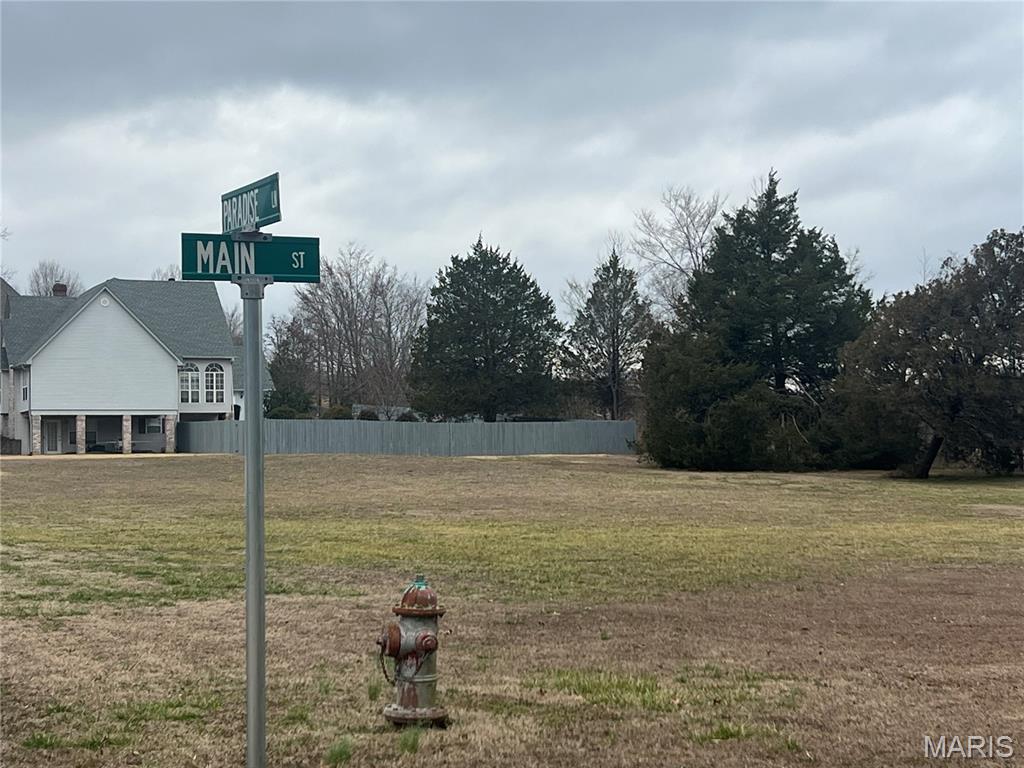 Lots 1 & 2 in Marble Hill Estates offer an excellent opportunity to build your dream home in a highly desirable North Town location. Situated on the corner of Main Street and Paradise Lane, these spacious lots provide the perfect blend of a peaceful country setting while still enjoying the convenience of city streets and city services. Public water and public sewer are available, and there is no HOA. Reasonable restrictions are in place to help protect property values, including a minimum 2,400 sq. ft. home requirement. Prime location with beautiful surroundings—ask about build-to-suit options and start planning your custom home today!
