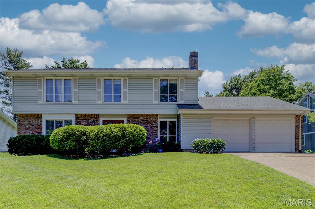 Well-maintained 2-story in sought-after Meadowbrook Farm offers 4 bedrooms, 2 full and 2 half baths in unbeatable Chesterfield location in high rated Parkway Schools. With 2,876 total sq ft of living space, this home combines generous room sizes, flexible floor plan & numerous updates designed for comfortable everyday living. Low-maintenance exterior features updated architectural roof, Leaf Relief gutters, brick front/trim, vinyl siding, enclosed soffits/fascia & oversized 537-sq ft garage. Situated on deep, attractive lot, outdoor living is a delight w/fabulous 19' x 16' screened porch & inviting brick patio - perfect setting for relaxing or entertaining. Living & dining rooms showcase neutral carpet/paint & wood flooring in family room. Built-in bookcases & 2 fireplaces (gas & woodburning) add warmth & character, while the versatile layout allows rooms to easily adapt as living spaces, dining areas or home office. Kitchen offers abundant wood cabinets, updated stainless appliances & convenient French door walkout. Main floor laundry room w/upgraded exterior door for added functionality. Inviting primary suite features walk-in closet & Bath Fitter shower conversion. Finished lower level expands living space w/generous-sized recreation room, wet bar & recessed lighting. Additional highlights include beautiful decorative glass front door, toilets/faucets in above-grade baths, 6-panel doors & extra attic insulation/Trane furnace (2026) for enhanced efficiency. Filled with natural light and enduring features, this exceptional home is ready to welcome its next owners.