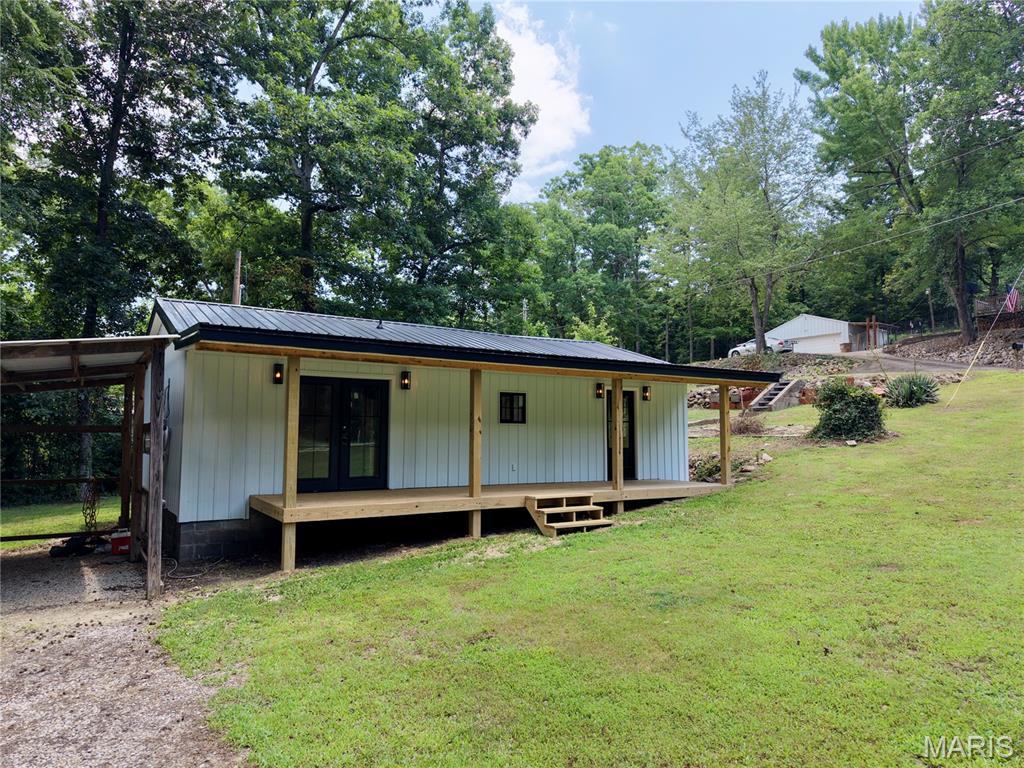 Live the lake life at 35 Marler Drive in Wappapello, Missouri! This newly remodeled 1-bedroom, 1-bath home sits on two lots and offers the perfect blend of comfort, convenience, and recreation. Inside, you'll find a spacious floor plan featuring all-new flooring, appliances, lighting, and more. Outside, enjoy a huge front yard, a brand-new front porch, and a large two-car carport with plenty of room for vehicles, boats, or lake toys.

Located just minutes from Lake Wappapello, this property puts you close to countless outdoor amenities. You're less than half a mile from Sundowner Marine and the boat ramp, and approximately one mile from Peoples Creek Recreation Area, offering a public beach, boat ramp, picnic tables, covered BBQ areas, and more. Whether you're looking for a full-time residence, weekend getaway, or an investment with short-term rental potential, this property is ready for you to enjoy everything Lake Wappapello has to offer.