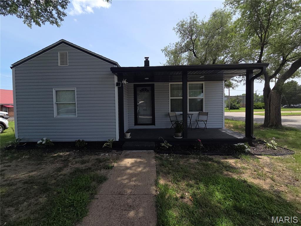 This completely remodeled 2 bedroom, 1.5 bath home offers spacious living with an open and inviting layout.  Features include an eat-in kitchen with bar and generously sized rooms throughout, and a convenient laundry area located just off the kitchen.   A mud room at the rear entrance provides additional storage and practicality.  
Enjoy relaxing on the covered front porch or spending time in the large side yard, perfect for outdoor activities, gardening, entertaining, or even for a garage or covered parking.  Situated on a large lot directly across the street from Sikeston Head Start for those with little ones.  This property offers both convenience and comfort.  
An additional highlight to the property includes a 17.5x13.4 concrete block shed with a concrete floor.  Ideal for storage, a workshop, or hobby space.