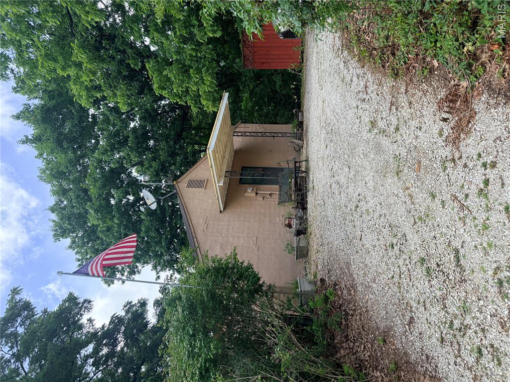 Second Chance on this property - Back onmarket - no fault of seller!
This 1 bed, 1 bath bungalow sits on 2+ acres with blacktop frontage and great country location. The property backs to mature woods and a creek, offering privacy, peaceful views, and a beautiful natural setting. Inside, you'll find a spacious living room featuring a cozy wood-burning fireplace, a separate dining room, and plenty of room to reimagine the space to suit your vision. The home is currently livable and ready for updates, making it an opportunity for investors, rehabbers, or buyers looking for there own home with room to add value.
The existing structure provides a solid starting point with stucco exterior, a detached two-car garage provides ample storage space for vehicles, recreational equipment, tools, or workshop needs.
Plenty of room to renovate, expand, or simply enjoy the serene surroundings. 
Property to be sold in as is condition.