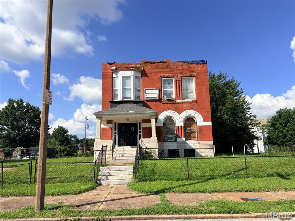 Investor’s Special!!! –Central West End! Welcome to 4415 Washington Blvd, a two-story brick home with incredible potential for the investor, rehabber, or developer.  There is 2874 sq ft of space and the adjacent lot offers 7500sq ft of outdoor space to build on or for your leisure. It has a 2-car brick garage on the back. Located just minutes from Forest Park, Central West End shopping & dining, and the medical Corridor in a vibrant community. The property was impacted by the May 2025 St. Louis tornado and is now being sold strictly as-is. The property is missing part of the roof and is currently covered with a tarp. Therefore, the property does have some water/mold damage. Enter at your own risk. By entering the property, you acknowledge that the seller and listing agent are not responsible or liable for any injuries, accidents, damage, or losses that may occur while on the property. Buyer/ Buyer’s agent to verify all information, including zoning, permitted uses, square footage, and redevelopment potential. Please contact the listing agent for additional information. Don’t miss this exceptional opportunity to restore a historic brick property with tremendous upside!