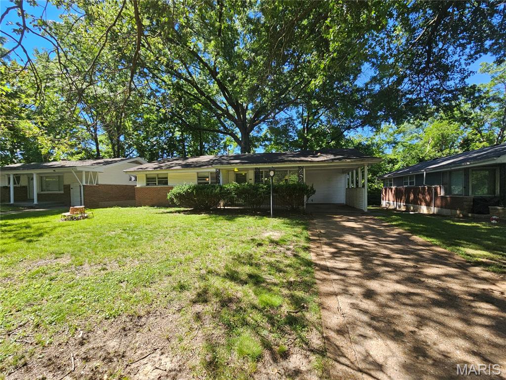 Welcome to 2356 Gardner DR, STLS MO 63136, a 1955 single-family residence. This inviting home offers a comfortable foundation for creating new memories and enjoying a relaxed lifestyle. The property features three thoughtfully arranged bedrooms, providing ample private space. Complementing these are two well-appointed bathrooms, designed for both convenience and ease. This charming ranch-style home also includes an attached carport, offering practical shelter for your vehicle. Discover the potential and comfort that awaits within this delightful residence.