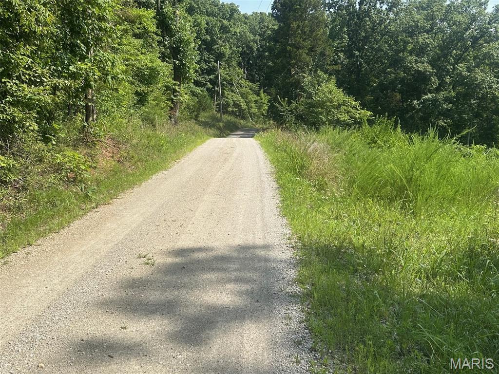 This partially developed 3.64 acre lot adjacent to Mirror Lake surrounded with peace and quite of nature has the foundation of a 3 1/2 car garage with space for a shop with 984 sf. Current owners will be happy to come out & show you the boundary of the lot. They will also provide a survey and building plan for a ranch home, septic plan, perk test which have all been professionally performed.  The Woods development has the feeling of seclusion between each lot for the privacy you are looking. Easy drive to City of Washington or Warrenton for all your shopping, and entertainment needs & near area wineries, Missouri River recreation, and local airport.