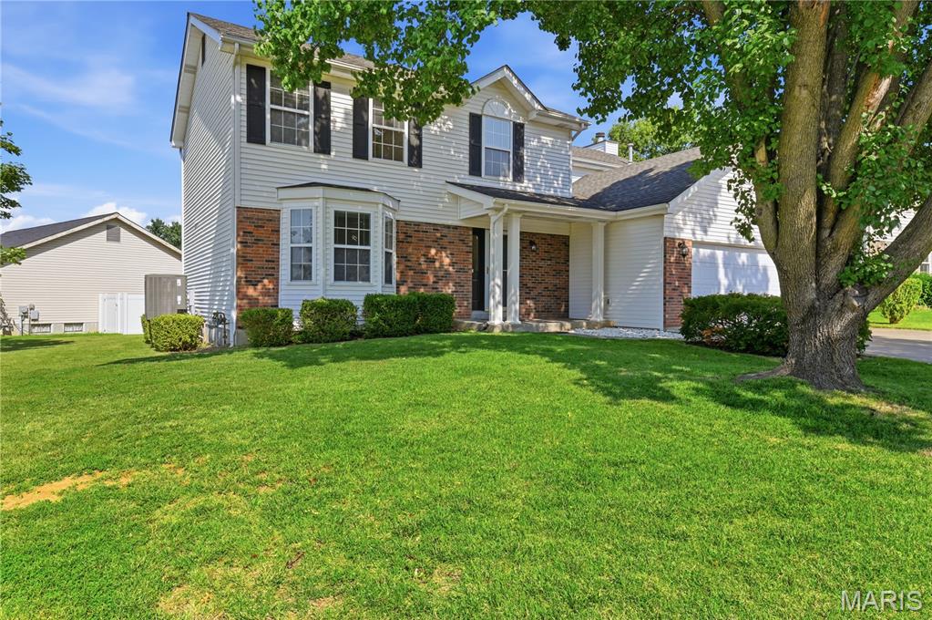 Welcome to this 2100+ square foot corner lot home featuring 3 bedrooms and 3.5 bathrooms, situated in a wonderful neighborhood! Upon entering, you'll discover a spacious front room to the left, complete with a bay window which leads into the separate dining area, great for hosting dinner parties. The kitchen with breakfast bar seamlessly connects to the living room, which boasts a cozy fireplace and sliding doors to the patio outside.  A half bath is conveniently located in the hall, as well as the laundry room being right off the kitchen.  As you head up, you'll find a bonus space at the top of the stairs, a full bathroom, and two well-proportioned bedrooms. The primary bedroom is exceptionally large, featuring a walk-in closet and an en suite that includes a separate shower, tub, and dual sinks. The finished basement offers a third full bathroom, along with a spacious recreational area equipped with a kitchenette. Adjacent to the rec room is a dedicated office space with a desk and storage. A sleeping area, complete with a built-in safe, is conveniently located near the stairs. The basement provides walk-up access to the flat backyard. Additionally, the oversized 2-car garage includes cabinetry for extra storage. The furnace, air conditioning unit, water heater and dishwasher are all relatively new. The  exterior walls were constructed with 2X6.