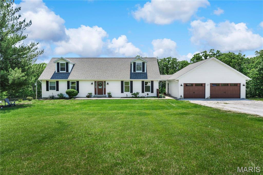 Own your own piece of paradise on this beautiful 10.4-acre farm featuring a large indoor riding arena with 3 stalls and a tack room complete with a kitchenette and full bathroom — ideal for equestrian enthusiasts or hobby farmers. The property is fully fenced with cross fencing already in place.
The updated 1.5-story home features a remodeled open floor plan, including a beautifully updated kitchen and dining area with granite countertops and updated appliances (2019-2021). Additional highlights include a spacious two-story entry foyer, new hardwood flooring on the main level, and a full unfinished walk-out basement with additional living potential. A remodeled deck is accessible from both the dining area and the main-level primary bedroom and provides the perfect place to enjoy peaceful country views and stunning sunsets.
Major improvements include an oversized detached garage (2020), new roof and 6" gutters (2020), and a new furnace and A/C system (2025).  Deed restrictions apply — just enough to help protect property values and keep the neighborhood well maintained. Peaceful country living awaits! Come join us at our open house on Saturday, May 23, 2026 from 1-3pm and see all of this FABULOUSNESS for yourself!  (neighbors are welcome too).
