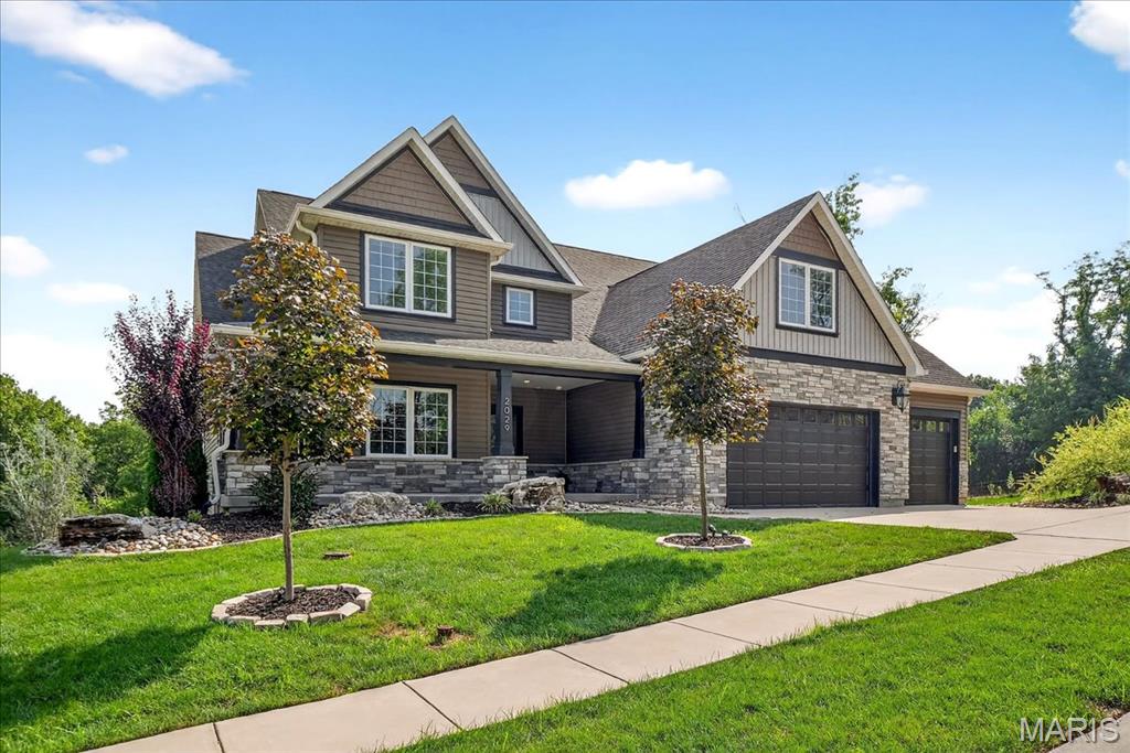 This show-stopping home is straight out of a magazine! Every inch of this stunning property has been thoughtfully designed with impeccable taste & attention to detail. From the architectural flow to the artistic finishes, it offers the kind of style & sophistication typically reserved for HGTV-worthy dream homes. Whether you're hosting intimate gatherings or lively celebrations, this space is sure to impress. Enjoy a vaulted-covered deck with gas fireplace that is perfect for outdoor dining, relaxation, or entertaining. Inside, the soaring light-filled Great Room welcomes you with an impressive stone gas fireplace and an open layout. The Gourmet Kitchen is a chef’s dream, featuring custom cabinetry, professional-grade appliances, large island & a breakfast room. The main-level Owner’s Suite feels like a private retreat, complete with a luxurious spa-inspired bath & two walk-in closets. Additional main floor highlights include a formal dining room, laundry room & 3 car garage. Upstairs, you’ll find four generously sized bedrooms & two full bathrooms. The fabulous finished lower level offers even more space to spread out, with a second great room, bedroom suite with full bath, stylish kitchen/bar area, wine room, home gym, additional full bath, & walk out to covered patio and back yard. All this and the sought after Kirkwood School District. Why book a vacation when every day can feel like a resort? Welcome home!