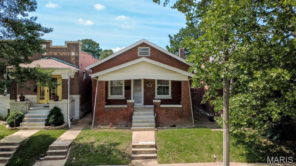 Welcome to 5218 Lisette Avenue—a charming South St. Louis home full of character, style, and functionality! This inviting 2-bedroom, 1-bath home features beautiful hardwood flooring throughout much of the main level, along with stunning stained-glass windows in select areas, adding timeless character and architectural charm. The spacious living room is filled with natural light and showcases a decorative fireplace, creating a cozy focal point for relaxing or entertaining. A separate dining room offers the perfect space for family dinners or hosting guests. The updated kitchen is truly a standout, featuring beautiful 42-inch cabinetry, solid surface countertops, and a stylish tile backsplash—blending beauty with everyday practicality. Both bedrooms are generously sized and continue the hardwood flooring, while the full hall bath is conveniently located on the main level. A versatile bonus room off the back of the home provides endless possibilities—ideal for a home office, family room, sunroom, or flex space to fit your needs. Downstairs, the walk-out lower level offers abundant storage space and easy access to the backyard patio. Step outside to enjoy the fenced backyard, perfect for entertaining, pets, gardening, or simply relaxing outdoors. Nestled in a desirable neighborhood close to parks, shopping, dining, and everyday conveniences, this home offers the perfect blend of classic charm and modern updates. Property has a passed occupancy inspection & ready to move in! Don’t miss your chance to make it yours!