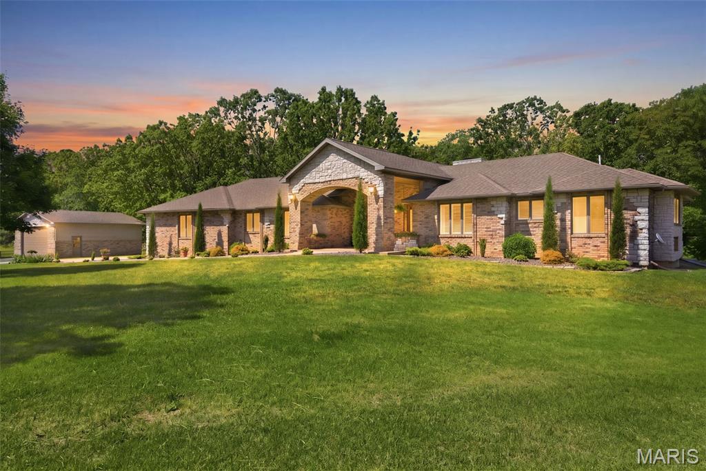 Beautiful one owner, custom all brick home offered for the first time on the market! Situated outside city limits on 15 acres, this impressive property features over 4,200 sq. ft. of living space with a paved private drive. The spacious home offers 4 bedrooms, 3.5 bathrooms, two living areas, two fireplaces, hardwood floors, a dedicated office, and a stunning living room with cathedral ceilings with beams. Zoned heat and air provide added comfort and efficiency throughout the home. Enjoy outdoor living with two private decks: one off the primary suite and another off the kitchen leading directly to the swimming pool. The property also includes a detached shop/garage with concrete floors and electricity, making it ideal for equipment, hobbies, or additional storage. Enough land for a few head of cattle or horses, but also perfect to sit back and just enjoy the Ozarks and all it has to offer. In the country, yet close to town and easy access to Hwy 60, this property combines privacy, functionality, and country living with all the features you've been looking for. Call today for your private viewing. Broker/Owner.
