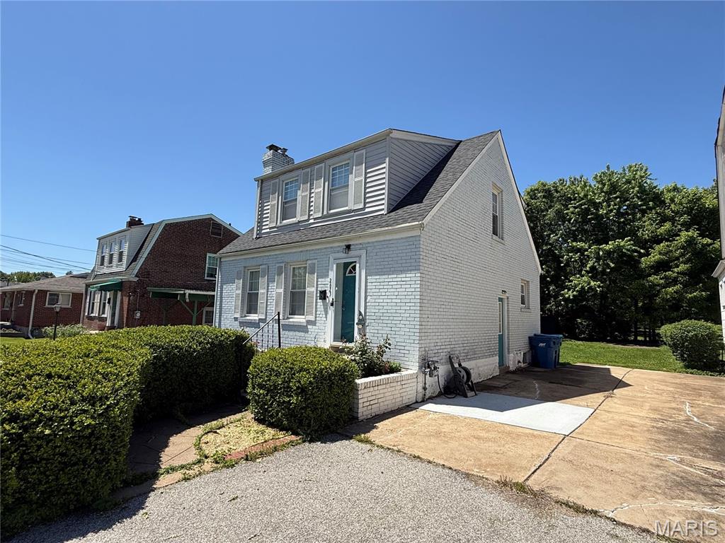 Charming and centrally located, this home is just steps from Marion Elementary School and minutes from highways 70, 170, and 270. Features include a cozy family room with fireplace, stylish kitchen with modern appliances, spacious dining area, exposed brick accents, updated upstairs bedrooms and bath, plus a finished basement with an additional bedroom, half bath, and extra living space. Enjoy a large backyard perfect for relaxing or entertaining, all near the Overland Farmer’s Market, Delmar Loop, and more.