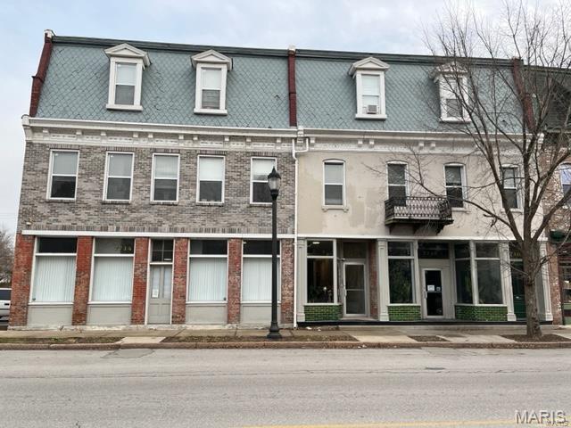 **New Listing | Commercial Investment Opportunity**

Discover an exceptional, completely rebuilt and fully renovated Mixed-Use historic building in the heart of Carondelet's business district. Everything new and replaced in 2019. This expansive 6,000-square-foot commercial offering spans multiple addresses, delivering a versatile layout featuring a kitchen, 2 handicap accessible bathrooms, 12 offices, a conference room and an open retail space + 3 basements, not included in the square footage. Office spaces starting at $400 monthly rent and up. Prices are negotiable. The spaces are full service and include all utilities plus use of restrooms, kitchen area and even community snacks. You cannot find a deal like this anywhere. 
Built with enduring quality in mind, this property showcases solid construction that has stood the test of time. Thoughtful renovations have modernized key areas while preserving the structural integrity that makes this building a reliable long-term investment. Updated finishes and improvements throughout enhance tenant appeal, ensuring competitive occupancy rates and steady cash flow for savvy investors.
The concrete parking  lot with 20 space is a standout advantage here, offering tenants the convenience that drives retention and attracts new renters in a competitive market.  The surrounding neighborhood enhances the property's appeal with everyday conveniences nearby. St. Louis Square Park sits just steps away, providing green space and recreation. Essential services, including fuel and grocery options along Bates Street, are easily accessible. Public transit connections at the Broadway and Holden bus stop keep commuters linked to the greater metro area, while Notre Dame High School serves families in the community. 
Schedule your showing today. Broker/Owner owned.