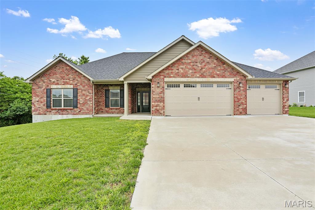 Better than new and designed for effortless living, this stunning ranch home in desirable Cedar Berry Estates offers stylish finishes, quality craftsmanship, and true main-floor living throughout. Only two years young, this home features zero-step entry from both the front door and garage, making accessibility and convenience a top priority. The striking full masonry front elevation creates incredible curb appeal, while inside you’ll find soaring vaulted ceilings, durable LVP flooring, and charming shiplap accent walls that add warmth and character. The beautifully designed kitchen is the heart of the home, showcasing granite countertops, tile backsplash, farmhouse sink, center island, pantry, under-cabinet lighting, and abundant cabinetry for storage and functionality. The spacious primary suite was thoughtfully designed with easy accessibility in mind and features an oversized walk-in closet, double vanity, and custom tile walk-in/roll-in shower complete with rain-head shower fixture. Need room for storage, vehicles and toys? This one has you covered with a fully finished 3-car garage with an additional storage/workshop area. Step outside to enjoy the covered patio overlooking a gorgeous, level 0.60-acre backyard offering endless possibilities for entertaining, gardening, or simply relaxing in a peaceful setting. Conveniently located just minutes from both Washington and Union, this move-in ready home combines modern comfort, accessibility, and country-style space in one exceptional package.