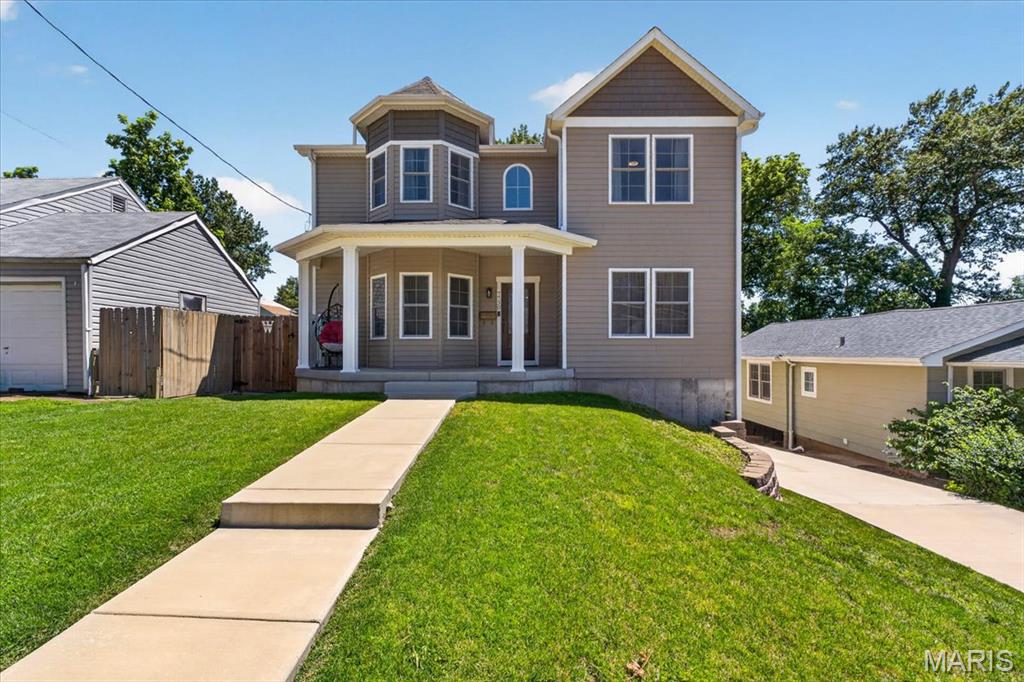Introducing a special home in the well-loved neighborhood of Maplewood. Built in 2022, this 2-story walk-out has 5 bedrooms, 3.5 baths and 3100+ SF of living space. The thoughtfully designed layout is a perfect balance of scale, comfort and functionality. Gorgeous wood floors run throughout the first level with lots of natural light coming in throughout the day. The main family room has built-ins, a gas fireplace and a bay window that looks out onto the front porch. The main floor also has a multi-functional bonus room with double doors that can be used for privacy and separation for an office/bedroom or left open as a playroom. 9 ft ceilings run throughout the main level with neutral paint colors. The sizeable, standout kitchen has custom cabinets, quartz countertops, stainless steel appliances, stove with exhaust hood, double wall oven, coffee counter, a massive island and large walk-in pantry. Tons of storage and cabinet space. The dining room is adjacent to the kitchen and open to the family room. Access to the maintenance free, rear composite deck is via the main living space. This layout is ideal for both daily living and for hosting gatherings. Upstairs has a spacious rear primary suite with spa-like bath, glass enclosed shower, separate tub, double sinks, and a linen closet. Upstairs laundry room and three additional well-sized bedrooms with nice closets complete this level. The finished walk-out basement has a 9 foot pour and storage room. The finished LL rec room has glass French doors leading out to the huge flat driveway and fenced in backyard area. LL also has a full bath with glass shower door. LL rear entry 2 car garage has plenty of room for vehicles and storage. Don't miss this rare opportunity to own a recently built home in the heart of Maplewood!