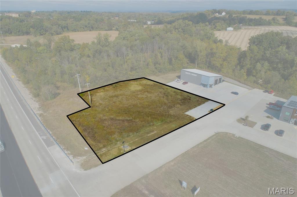 One acre of commercial land with over 200 feet of road frontage within the City limits of Washington, MO. This high traffic location on Highway 100 minutes from downtown Washington and Hwy 44. Water, sewer, and underground utilities are available. Lots of possibilities for this prime corner lot fronting on Hwy 100 in a high traffic, high visibility area in the city limits of a robust, growing town, & w/ close proximity to St. Louis! Location: Corner Location, High Traffic, Retail Center. Survey available upon request.
