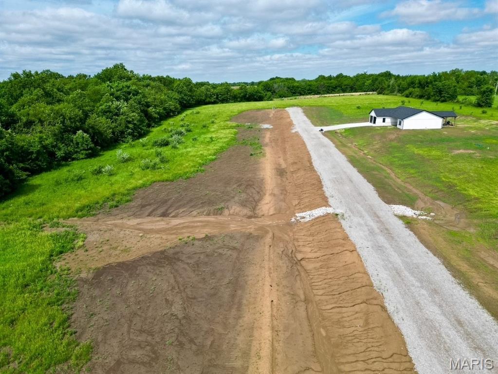 Your dream building spot is available, just 3 miles down HH right off Highway 61, Hannibal, Mo. This 3.34-acre lot is a gorgeous spot to build; the lot is level, with trees at the back of the lot, country living with all the conveniences, close by.  Water, electric and fiber are at the road. Bring your vision and make this home!