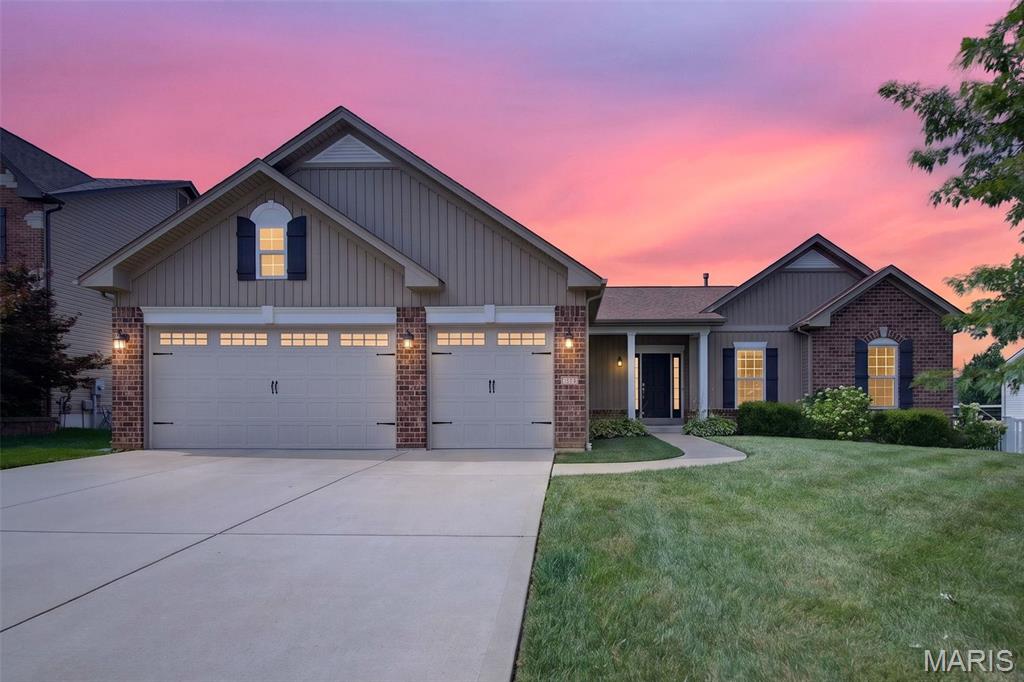 Welcome home to this beautifully designed 3-bedroom, 2-bath ranch offering an open floor plan, quality finishes, and endless potential in the highly desirable Fort Zumwalt School District. From the moment you step inside, you'll be greeted by a dramatic wall of windows that fills the living room, breakfast room, and kitchen with an abundance of natural light, creating a bright and inviting atmosphere throughout.

The spacious living area is accented with recessed lighting and a ceiling fan, seamlessly flowing into the well-appointed kitchen. Featuring granite countertops, stainless steel appliances, soft-close drawers, under-cabinet lighting, and an open layout overlooking the main living space, this kitchen is perfect for everyday living and entertaining alike. Just off the breakfast room, sliding glass doors lead to a low-maintenance composite deck—an ideal spot to relax, entertain guests, or enjoy warm summer evenings.

Convenience meets functionality with a thoughtfully designed mudroom featuring a built-in bench and hooks, a walk-in pantry, and a main floor laundry room complete with a utility sink.

The private primary suite offers two large windows for exceptional natural light, a generous 10x7 walk-in closet, and an en-suite bath featuring dual sinks, a walk-in shower, and a linen closet. Two additional bedrooms and a full hall bath complete the main level.

The walk-out lower level offers endless possibilities with an unfinished basement ready for your personal touch. Whether you envision an additional bedroom, recreation room, home theater, fitness area, or office, the space is ready to accommodate your lifestyle. A bathroom rough-in and sliding glass doors leading to the backyard patio provide even more flexibility for future expansion.

Additional highlights include a 3-car garage, beautifully landscaped front yard, and an excellent location close to parks, shopping, dining, and everyday conveniences. This home combines comfort, functionality, and incredible opportunity—all waiting for its next owner. 
Beyond the home, Hyland Green neighborhood offers community amenities including a neighborhood pool, basketball courts, and picturesque walking trails, creating a lifestyle you'll love year-round. Schedule your private showing today!