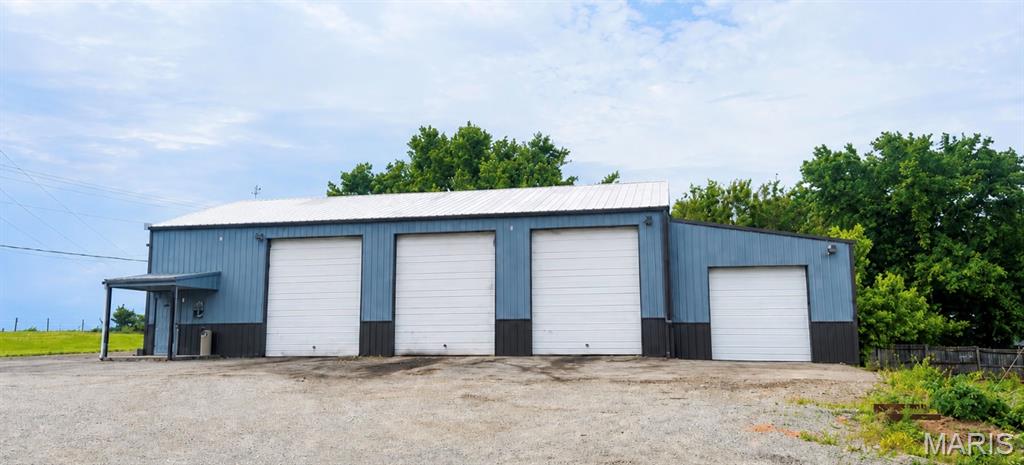 COMMERCIAL PROPERTY! 
3 buildings, 4 unrestricted acres, and endless possibilities — all in a great location with paved highway frontage just outside Fredericktown.

The main shop is 81’ x 43’ and features office space, a bathroom, 4 work bays, a 9,000 lb. lift, and parking out front.

The back shop is 45’ x 48’ with 3 additional bays, an office, a drive-on lift, and extra storage space in the rear of the building. Use it for overflow, lease it out, or create an additional income stream.

Also included is a 60’ x 12’ single-wide home located toward the middle of the property, offering the option for an owner residence, shop manager quarters, or rental potential.

Whether you’re ready to run your own business or expand your investment portfolio, this property is packed with opportunity.