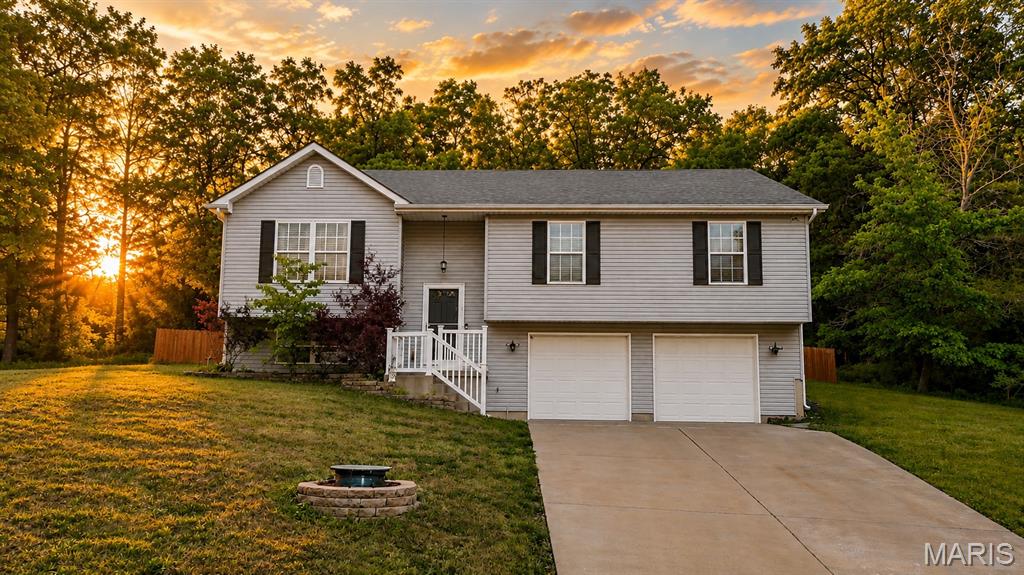 Welcome to your Home Sweet Home and Vacation 24/7 with PRIVACY all around. Sellers are motivated, so bring an offer!  It's pretty AMAZING to get such a great price, in this Raintree subdivision with all these wonderful amenities!! Raintree is a hidden GEM!  This BEAUTIFUL 4 BEDROOMS & 2 FULL BATHS with open floor plan welcomes you with plenty of natural light & a HUGE oversized garage!  Relax & unwind with your fully stocked custom-made movable large bar & a huge new deep freezer that comes with the house!  Your main bedroom has your walk-in closet, as that is a must! All rooms have T.V. mounts as well already installed! The fenced in yard is perfect for entertaining and pets. Lake is so close & walkable to fish or kayak/boat your cares away! Your private Home Sweet Home with breathtaking view surrounded by nature is on 1/2 an acre, surrounded by woods & privacy is what most people like in a subdivision, this one has it!  With white sandy beaches, 4 lakes, 18-hole golf course & golf shop, a boat launch, a HUGE saltwater pool with pool side bar & snacks, Country club W/ Restaurant, sports bar & fitness center.  The sought-after amazing Hillsboro school district is top notch!  A Raintree Gas Station Market & Grill is in front of subdivision open for your convenience. MAKE THIS HIDDEN GEM, YOUR NEW DREAM - BEFORE IT IS GONE!